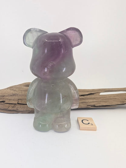 Exact-piece Rainbow Fluorite bear carving specimen C featuring purple face and green base.