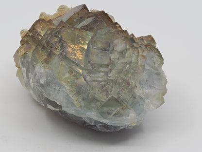 Top view of cubic Fluorite faces displaying natural rainbow iridescence and high surface luster.