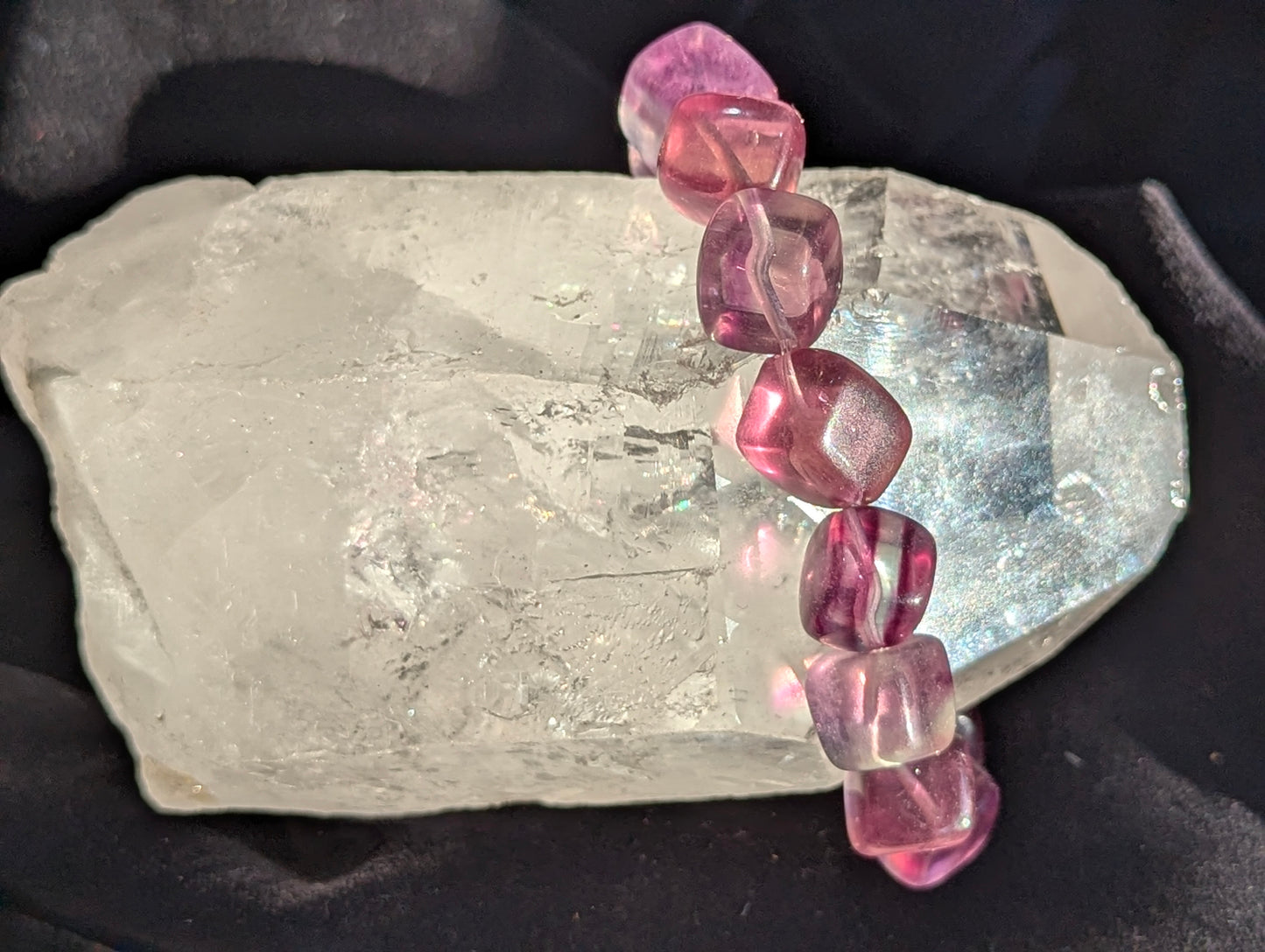 Premium 10mm Banded Purple Fluorite beaded stretch bracelet worn on the wrist to demonstrate its 17cm circumference scale and continuous mineral profile under balanced light.