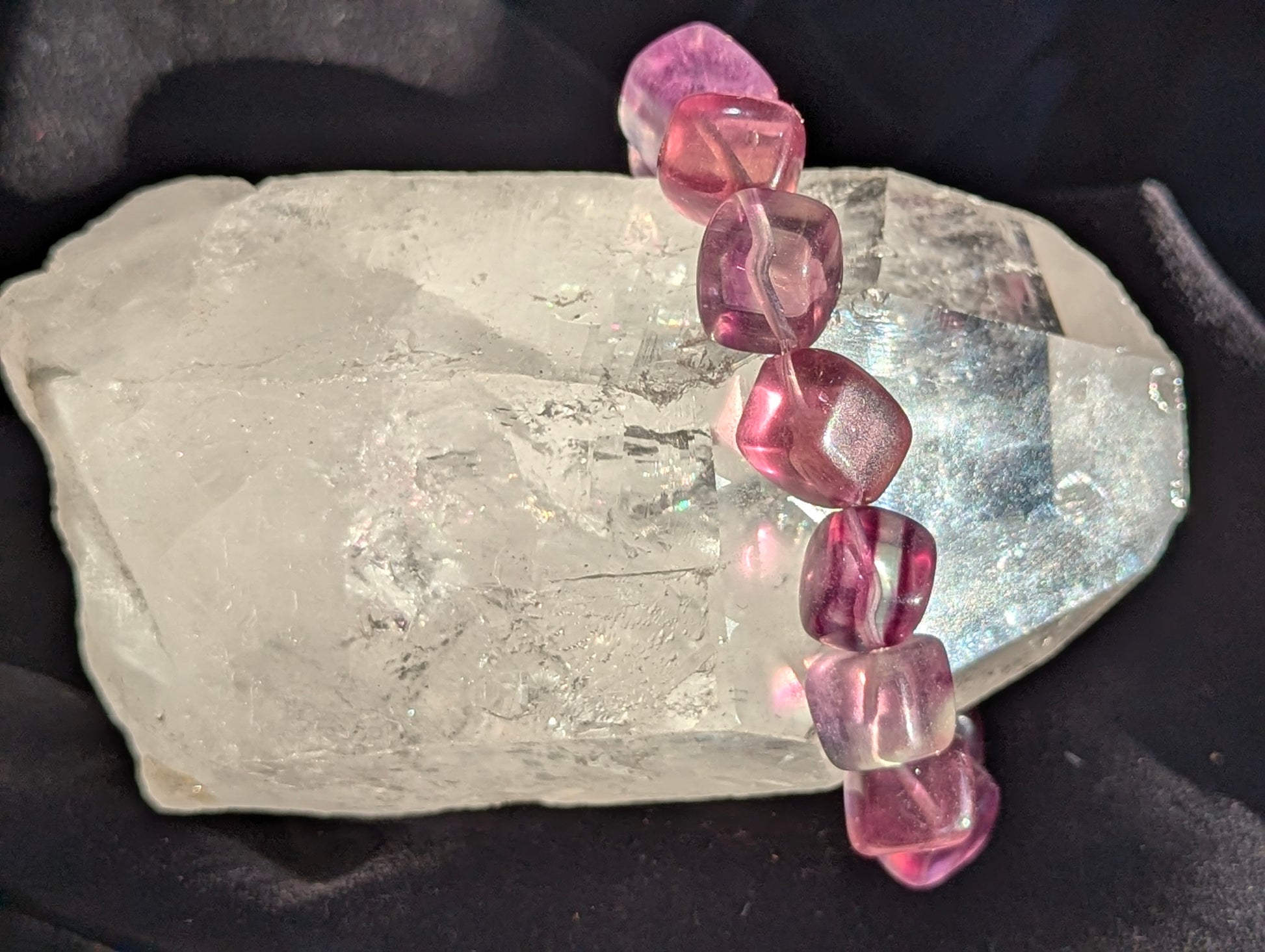 Premium 10mm Banded Purple Fluorite beaded stretch bracelet worn on the wrist to demonstrate its 17cm circumference scale and continuous mineral profile under balanced light.
