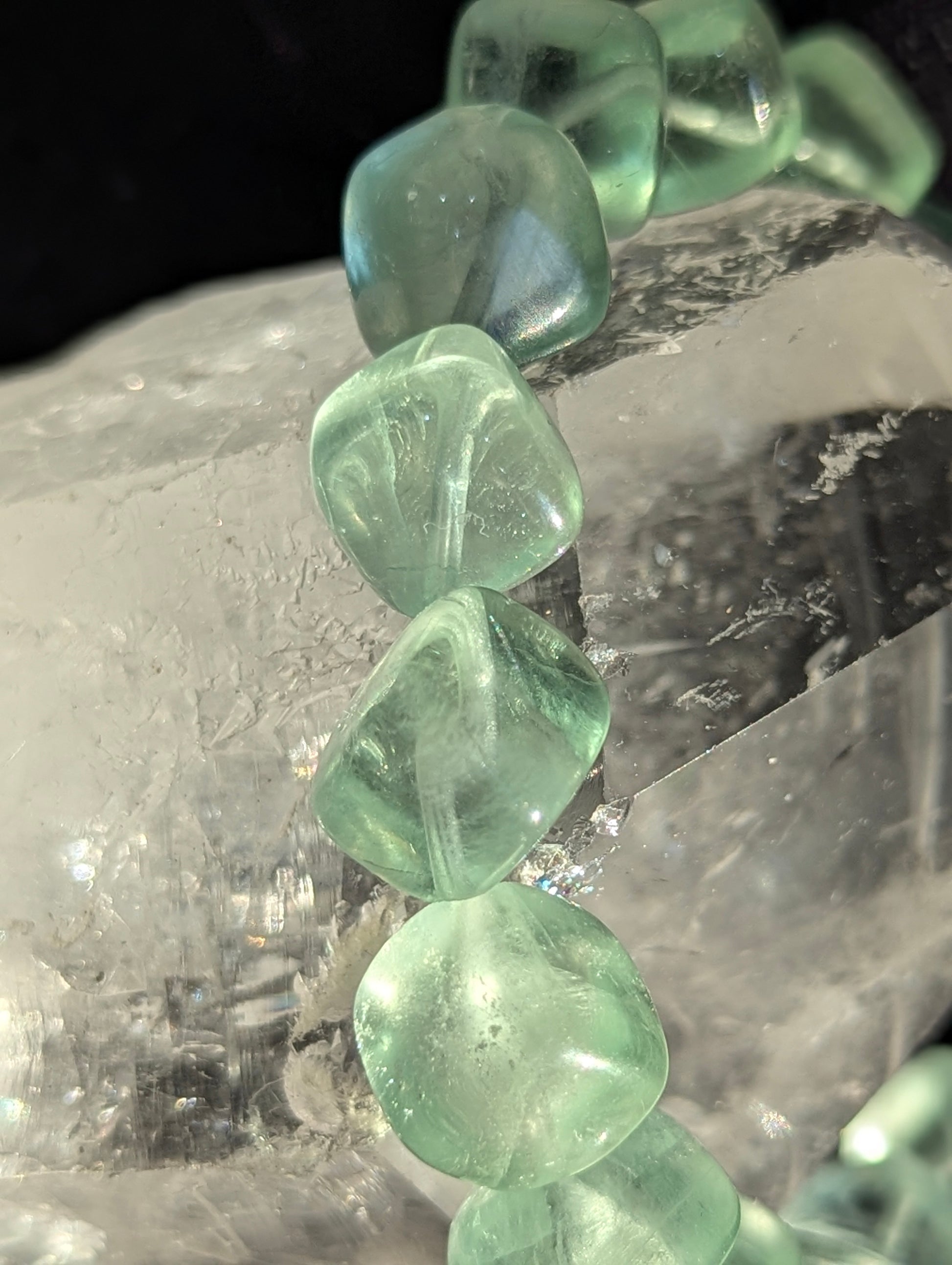 Macro close-up view of polished 11.5mm Green Fluorite cubes, highlighting the vitreous luster and pristine internal cleavage planes.