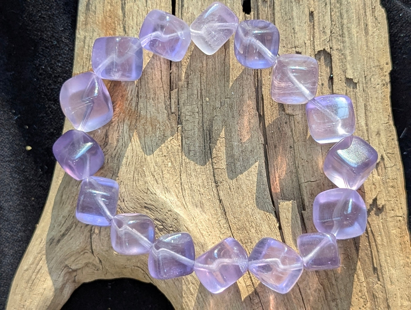 An alternate display angle of the premium 10mm Lilac Purple Fluorite beaded stretch bracelet, emphasizing the natural cubic form.