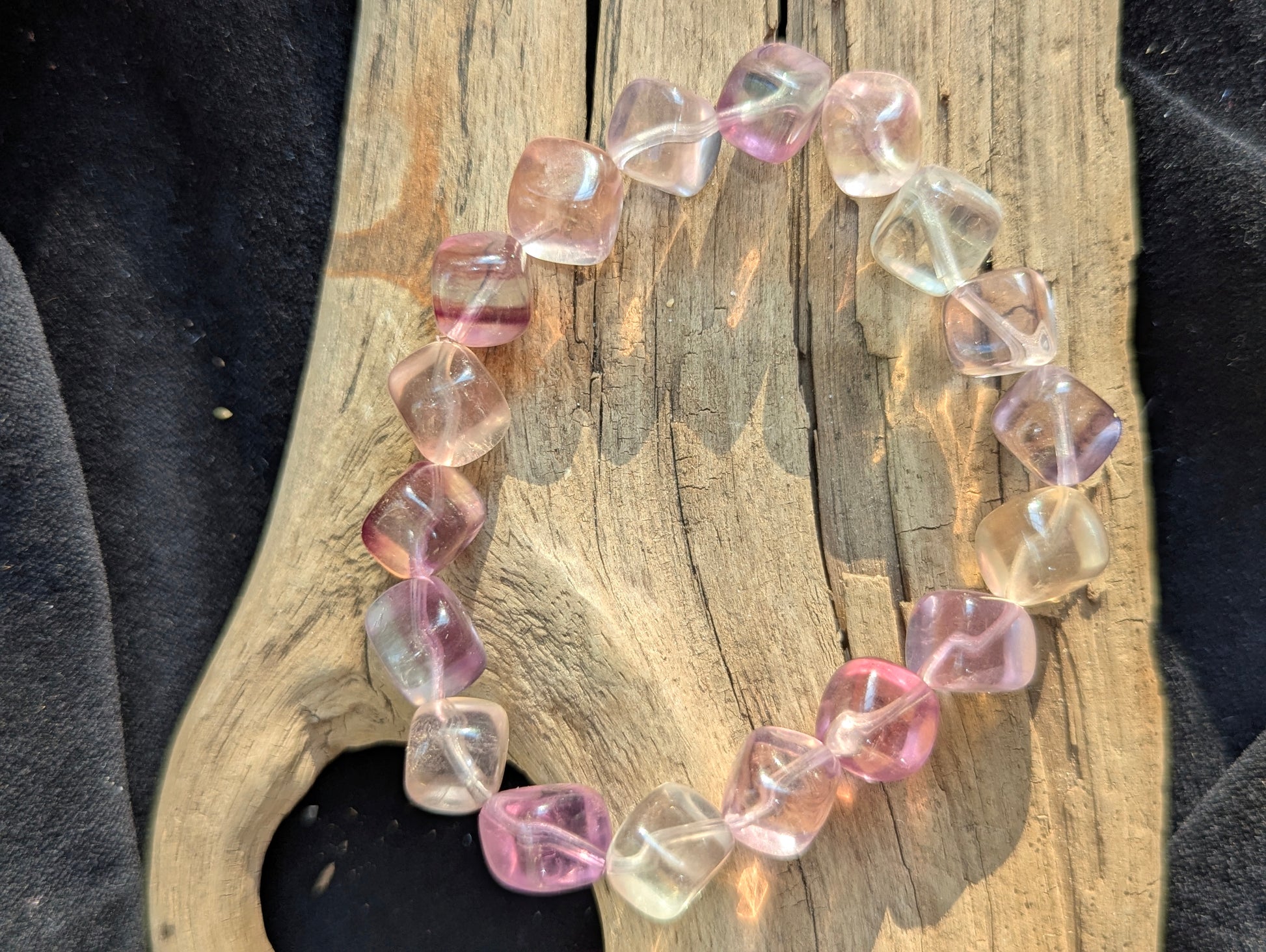 Detailed view of the 9mm Pastel Rainbow Fluorite stretch bracelet, emphasizing the transparent matrix and striking modern aesthetic.