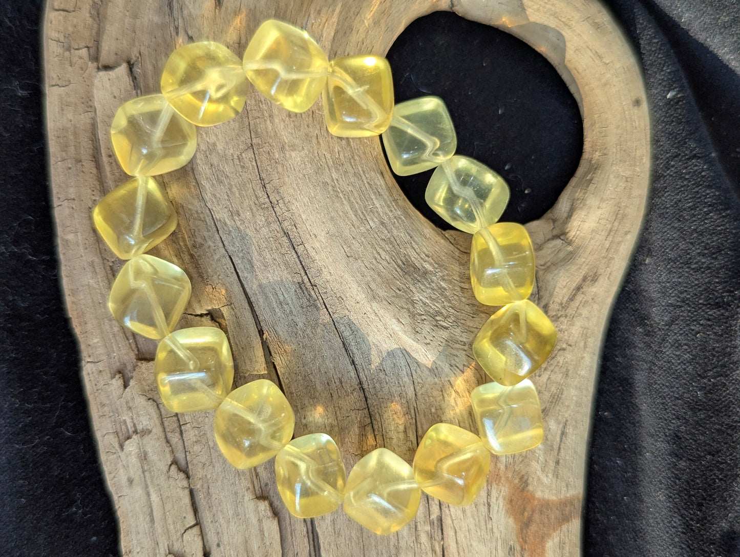Detailed view of the 11mm Yellow Fluorite stretch bracelet, emphasizing the un-stabilized natural yellow colour profile.