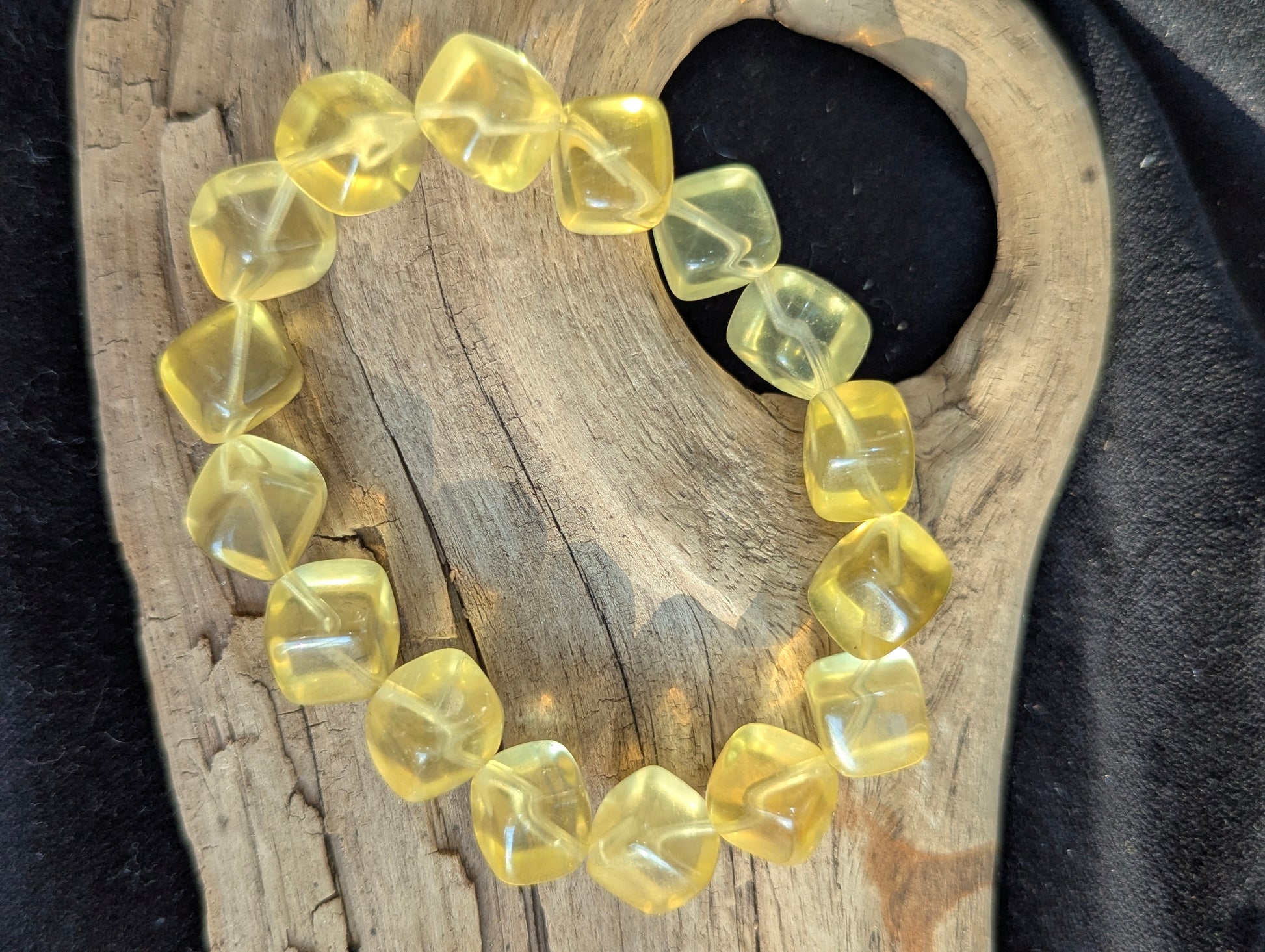 Detailed view of the 11mm Yellow Fluorite stretch bracelet, emphasizing the un-stabilized natural yellow colour profile.