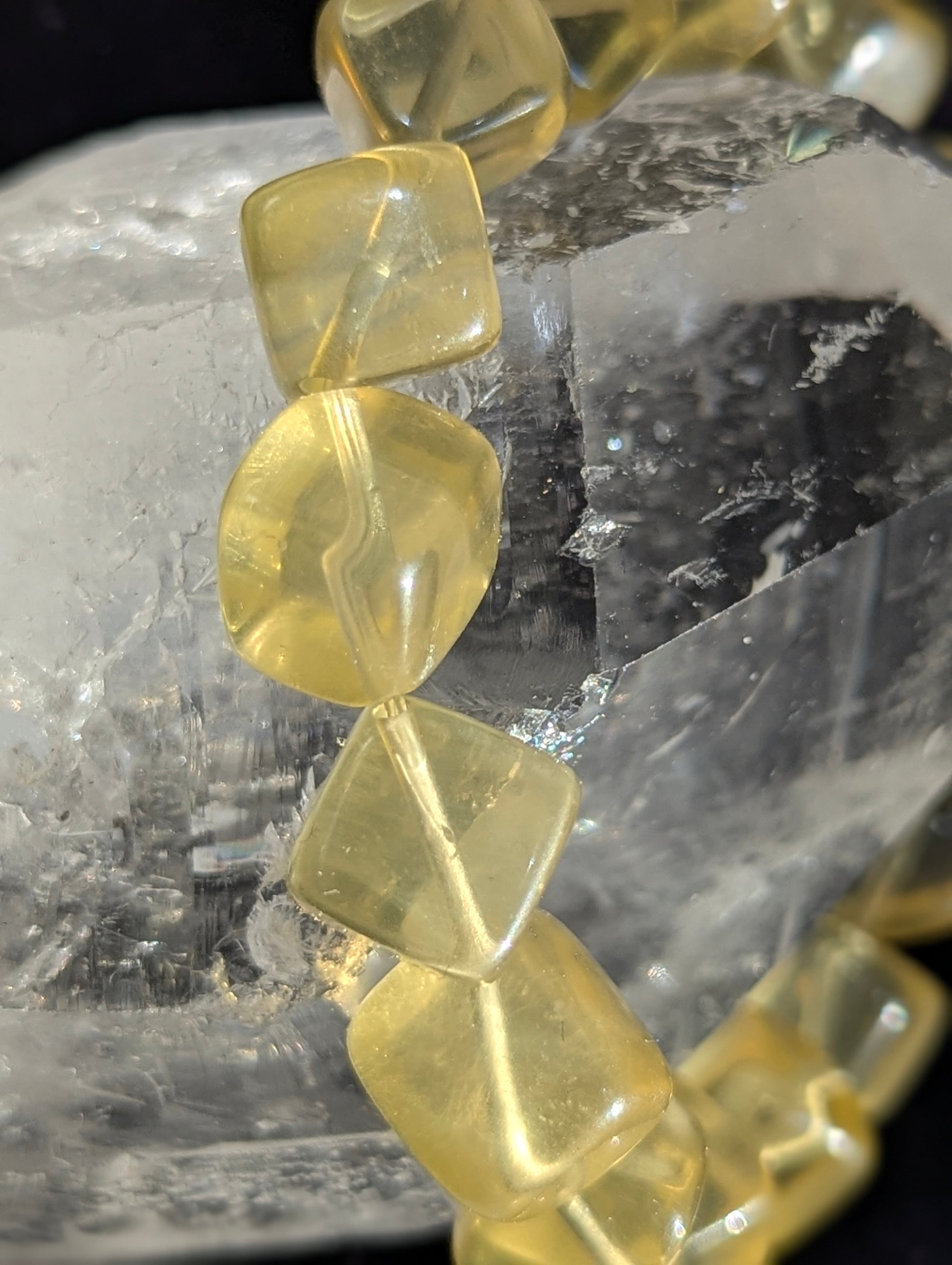 Macro close-up view of polished 11mm Yellow Fluorite cubes, highlighting the high transparency and pristine internal clarity.