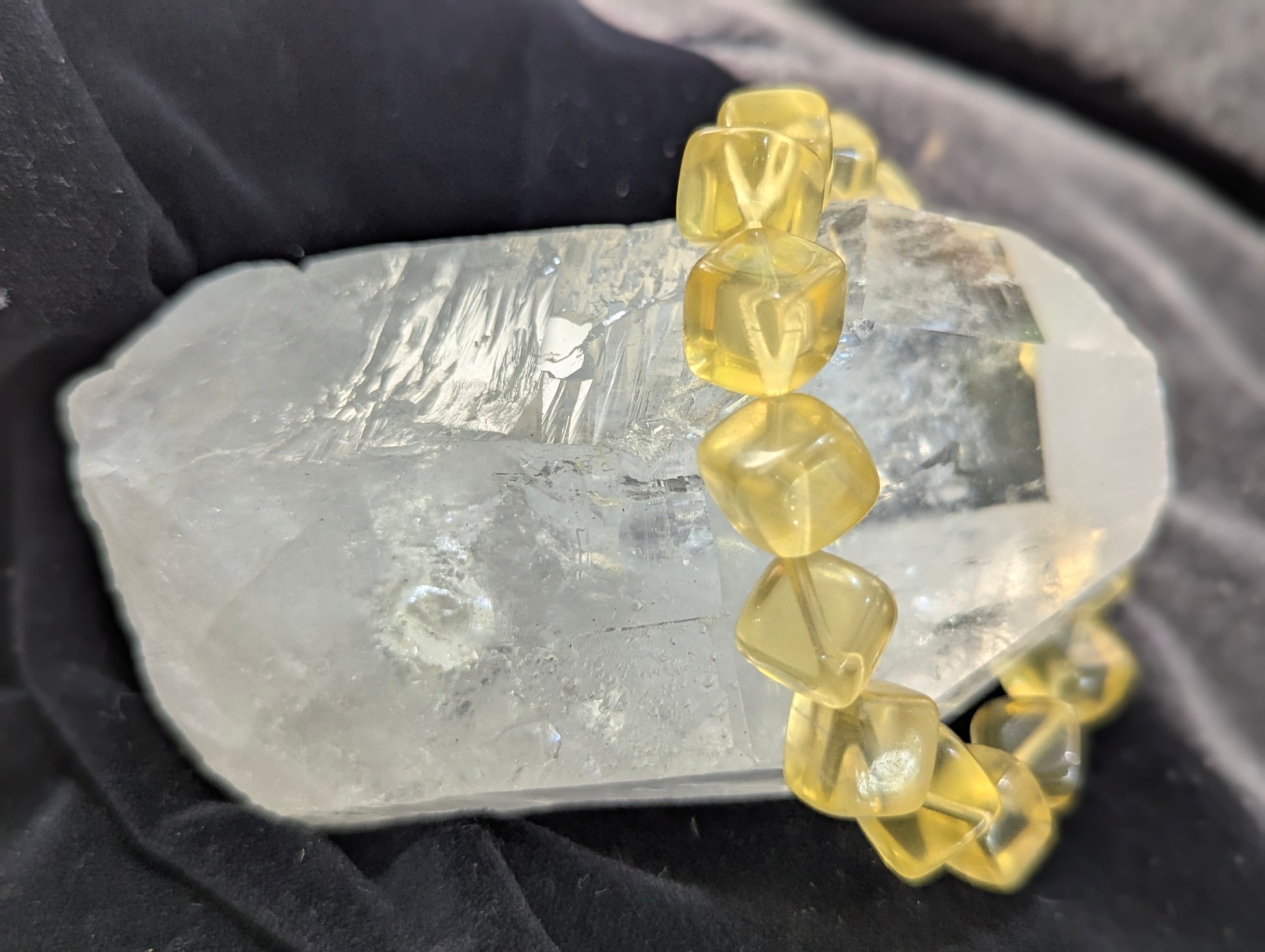 Premium 11mm Yellow Fluorite beaded stretch bracelet displayed on a wrist to demonstrate its 17cm scale and continuous structural profile.