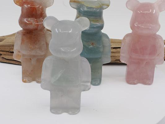 Front view of a natural Fluorite designer bear carving with ghost-grey translucency and high polish.