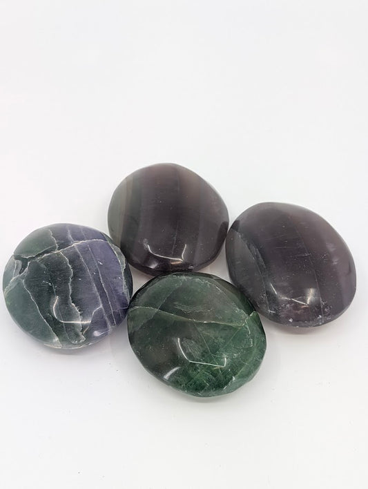 Fluorite Palm Stones showing green and purple color banding