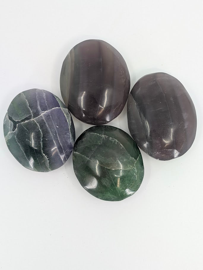 Top view of Fluorite Palm Stones showing translucency