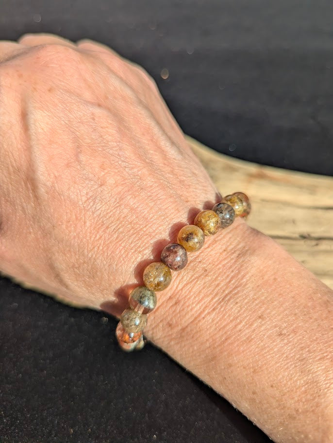 8mm AA Grade Four Season Garden Quartz beaded stretch bracelet worn on a wrist for scale demonstration.