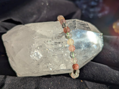 A 6mm Garden Quartz beaded bracelet worn on a wrist to demonstrate its 17cm (6.69") fit and natural colour saturation.