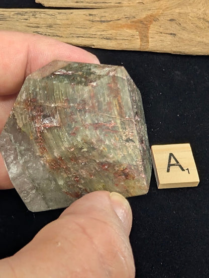 Reverse view of exact piece Garden Quartz faceted freeform, Variant A1, showing dense chlorite and iron oxide deposits.