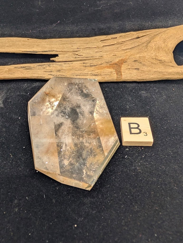 Angled view of exact piece Garden Quartz faceted freeform, Variant B3, showing high clarity and layered internal scenery.