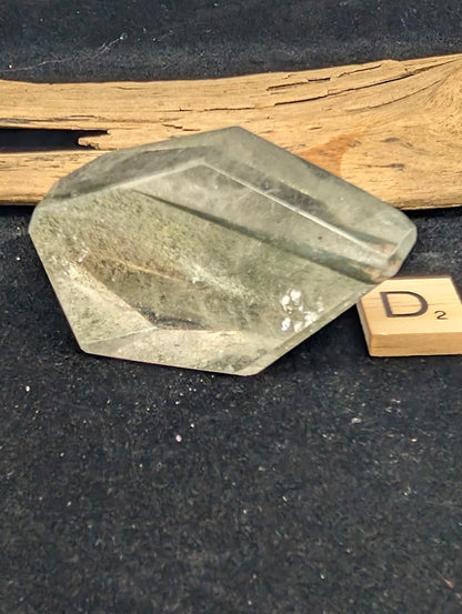 First angled view of exact piece Garden Quartz faceted freeform, Variant D2, showing depth of green chlorite inclusions.