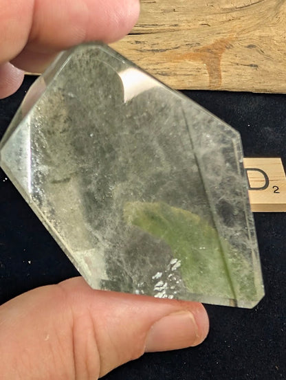 Second angled view of exact piece Garden Quartz faceted freeform, Variant D2, highlighting the polished faceted surfaces.
