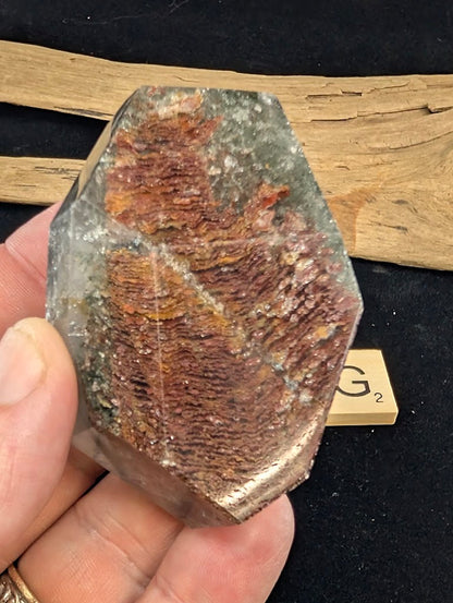 Reverse view of exact piece Garden Quartz faceted freeform, Variant G2, detailing the rich rust-red inclusions.
