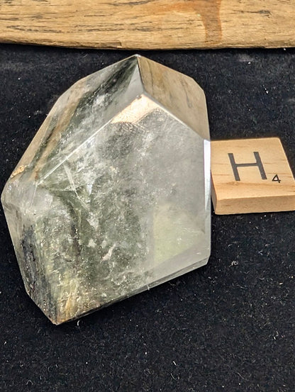 Angled view of exact piece Garden Quartz faceted freeform, Variant H4, highlighting the high clarity quartz matrix.