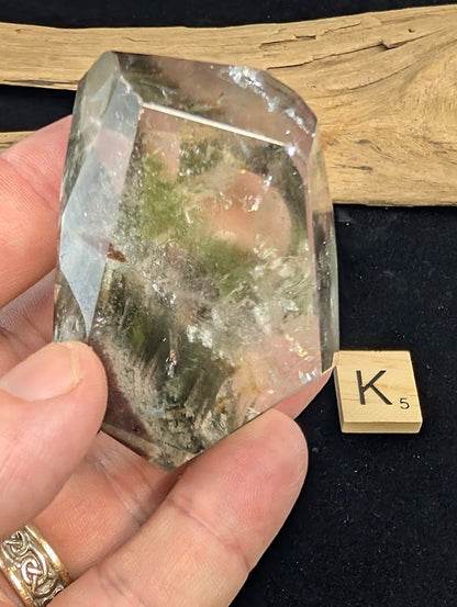 Reverse view of exact piece Garden Quartz faceted freeform, Variant K5, detailing the green chlorite formation.