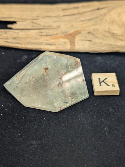 Exact piece Garden Quartz chunky freeform, featuring a highly concentrated central cluster of dark and reddish-brown minerals.