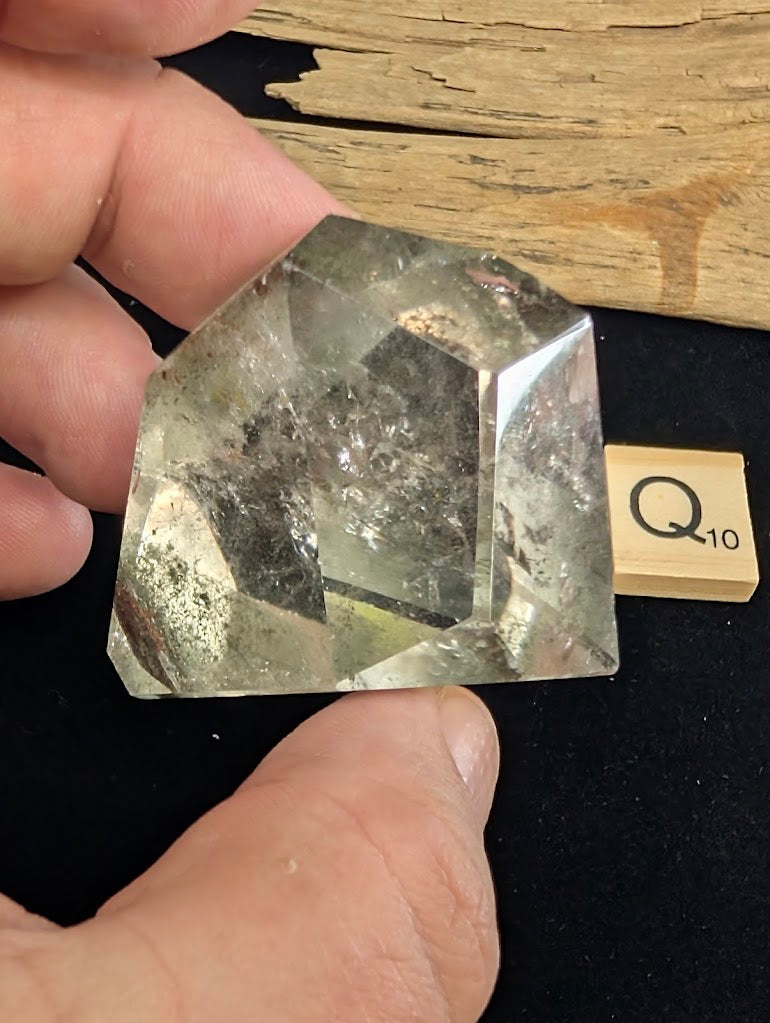 Exact piece Garden Quartz steep point freeform, featuring high clarity and a distinct deep red tubular inclusion near the base.