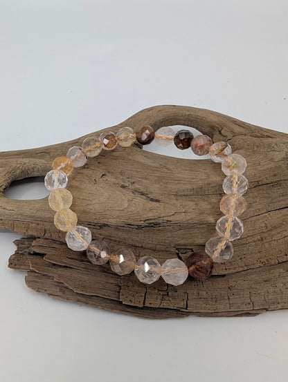 8 mm Golden Healer Quartz bracelet showing faceted clear and gold tones