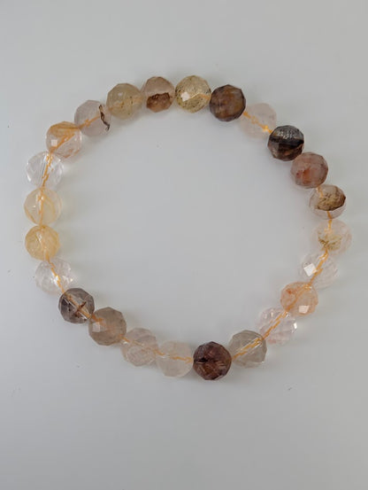 Faceted Golden Healer Quartz bracelet with transparent and amber beads