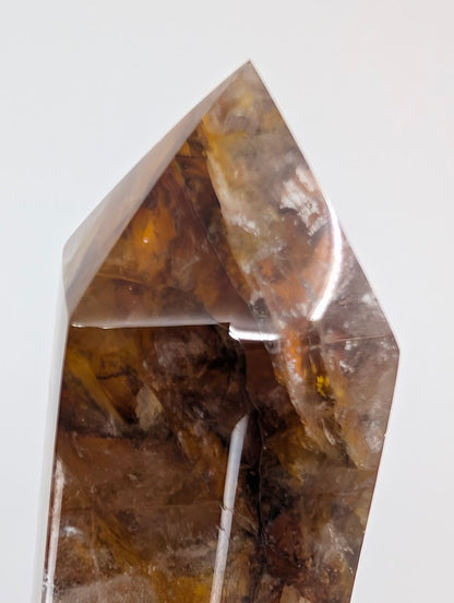 Tall Brazilian Golden Healer Quartz Tower under light