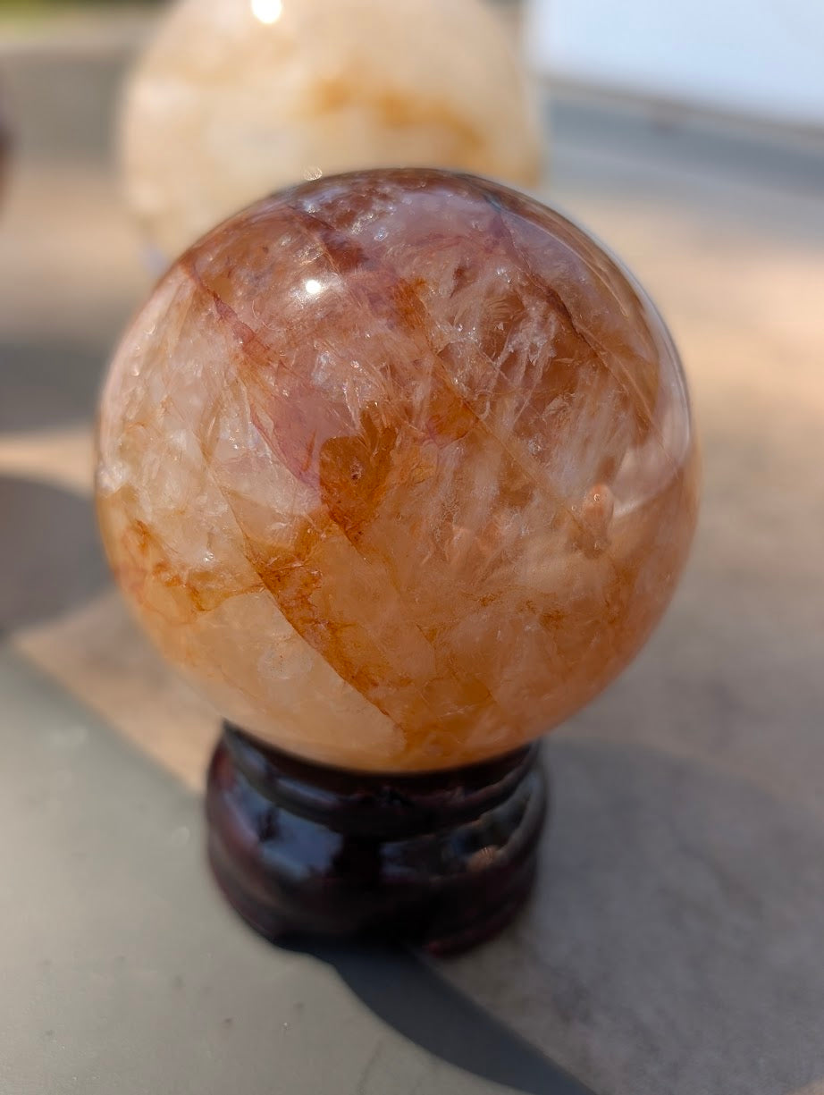 Close-up of Golden Healer quartz sphere GHS-06 highlighting fully flooded internal structure of iron oxides.