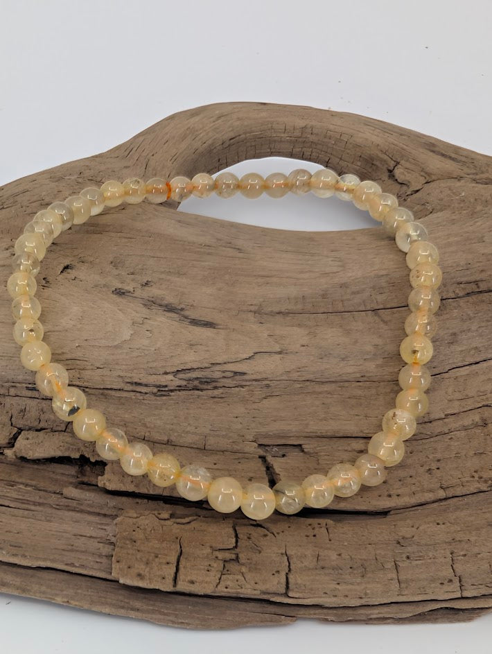 4 mm Golden Rutile Quartz bracelet with fine golden inclusions