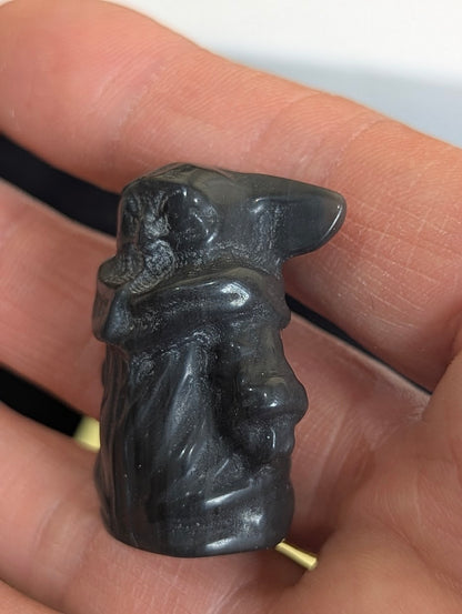 Angled rear view of a Gorku totem precision-carved in Black Obsidian.