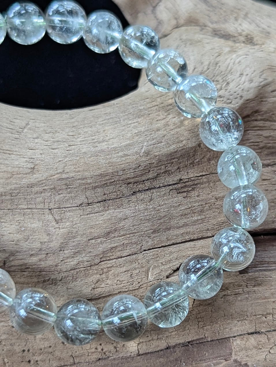 Close-up of 8mm Green Amethyst (Prasiolite) Bracelet, showing high-clarity quartz and internal structure.