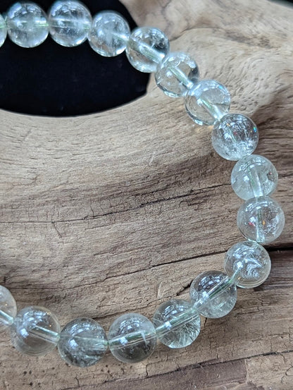 Close-up of 8mm Green Amethyst (Prasiolite) Bracelet, showing high-clarity quartz and internal structure.