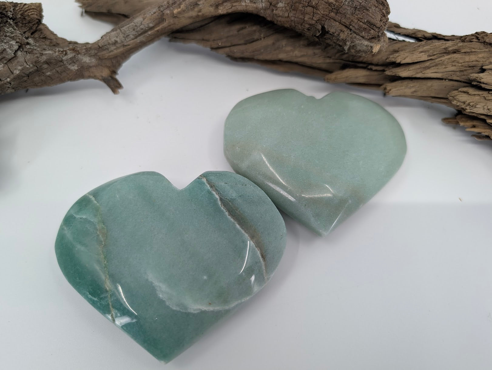 Pair of large Green Aventurine hearts showing soft mint and sage colors.
