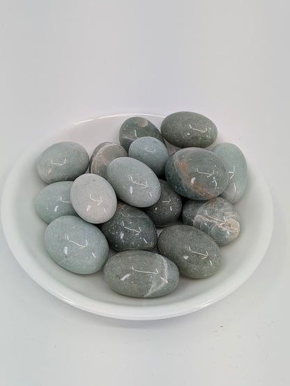 AA grade Green Aventurine tumbled stones displayed in bowl showing even mid-green color and high polish finish