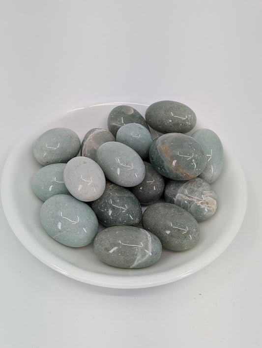 AA grade Green Aventurine tumbled stones displayed in bowl showing even mid-green color and high polish finish