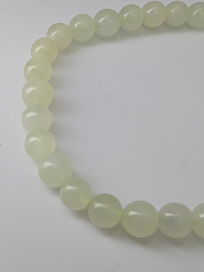 Detailed view of polished Green Calcite beads