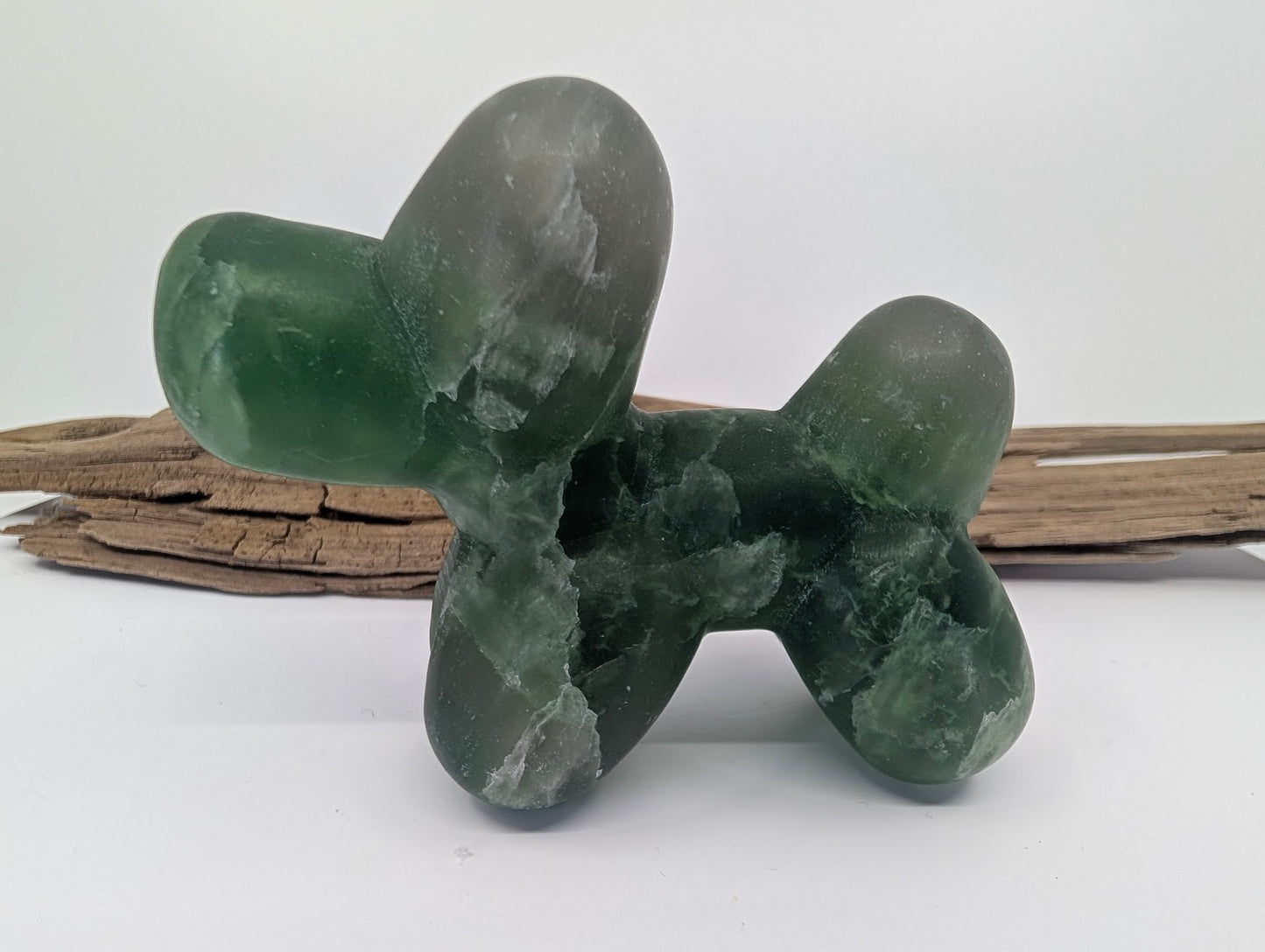 Vibrant emerald Green Fluorite balloon dog specimen D from China highlighting natural clarity.