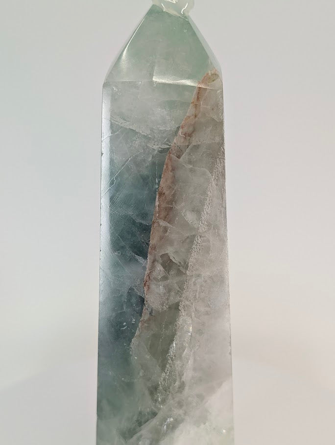 Close-up of fluorite with iron oxide and quartz veins