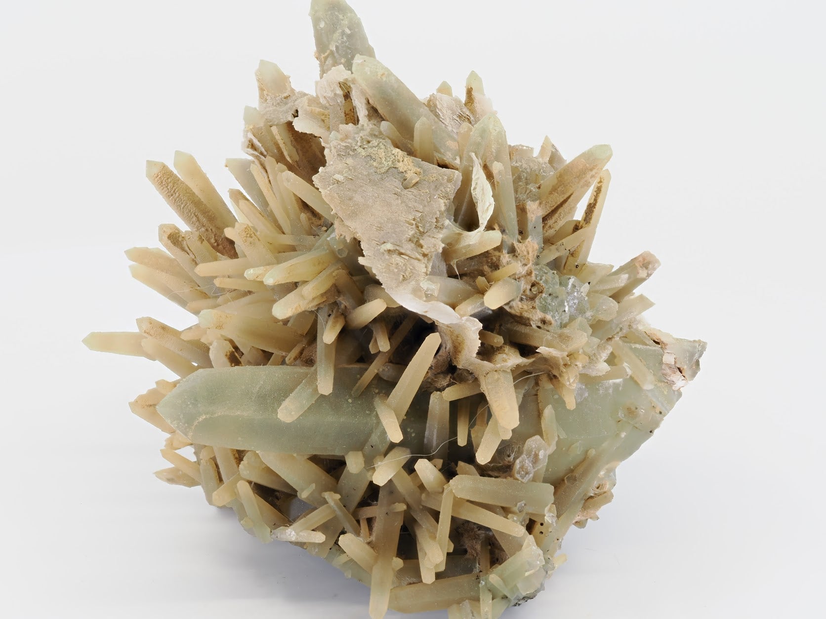 Full display view of sage green quartz cluster with flower-like crystal habit.