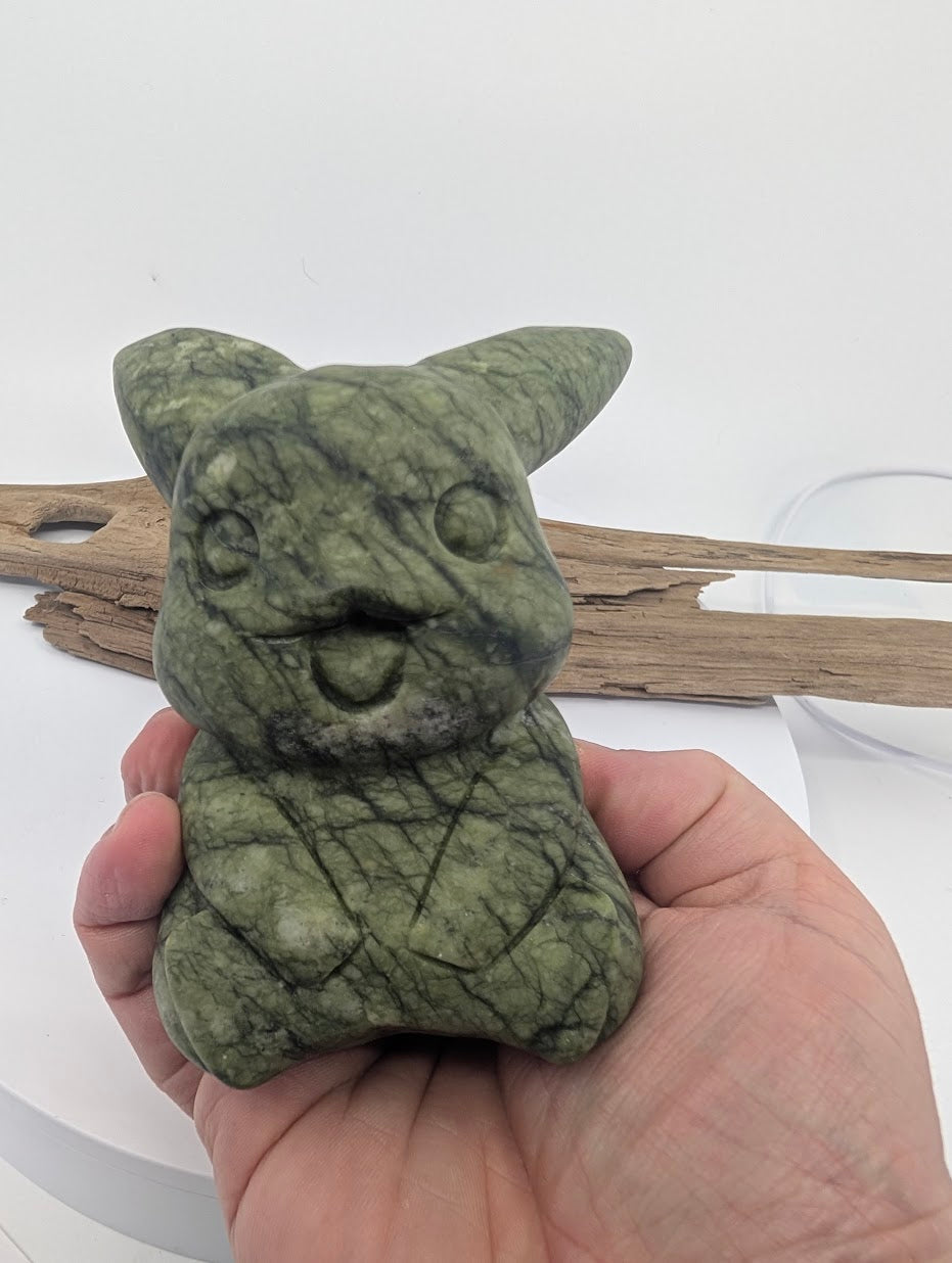 785g Green Jade Pikachu held in hand to show significant scale and solid Nephrite structure.