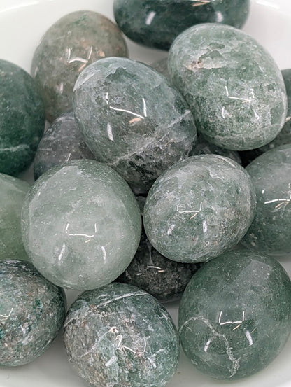 Close-up showing natural green mineral inclusions in quartz