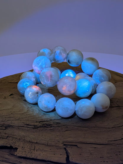 8mm hackmanite bracelet glowing blue and pink under UV black light