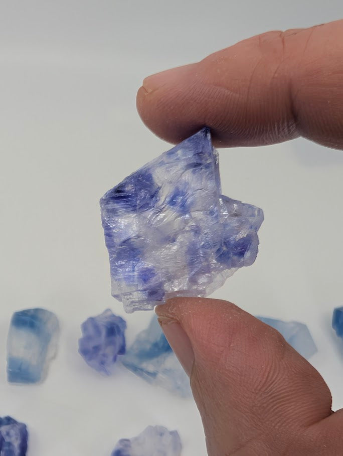 Blue halite specimen with layered zoning and raw edges