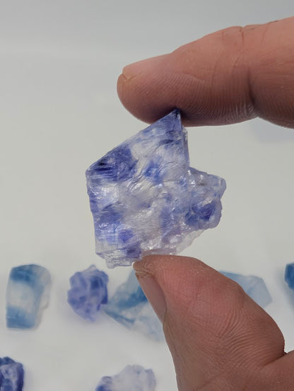 Blue halite specimen with layered zoning and raw edges