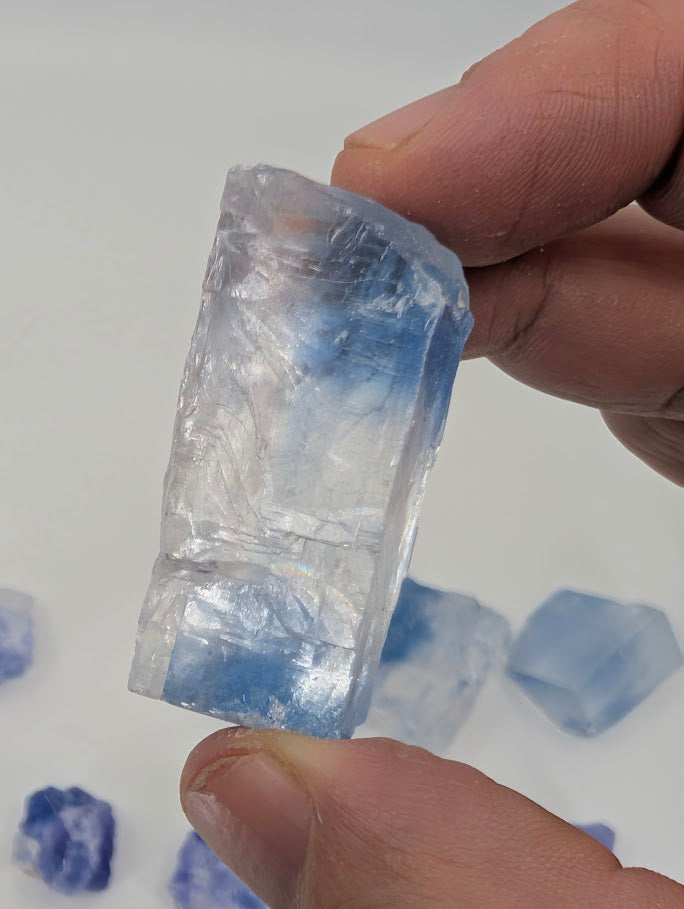 Blue halite specimen with bold zoning and raw cubic texture