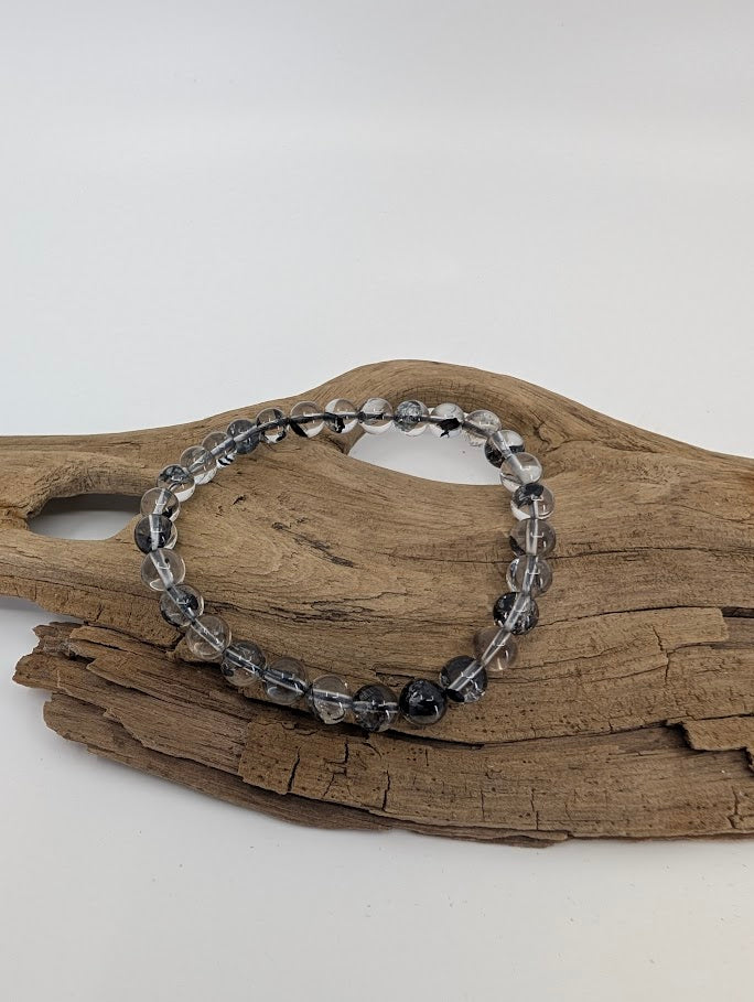 High clarity Herkimer style quartz bracelet in natural light showing transparent beads