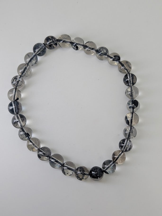 Top-down view of 6.8mm HQ Herkimer style quartz bracelet