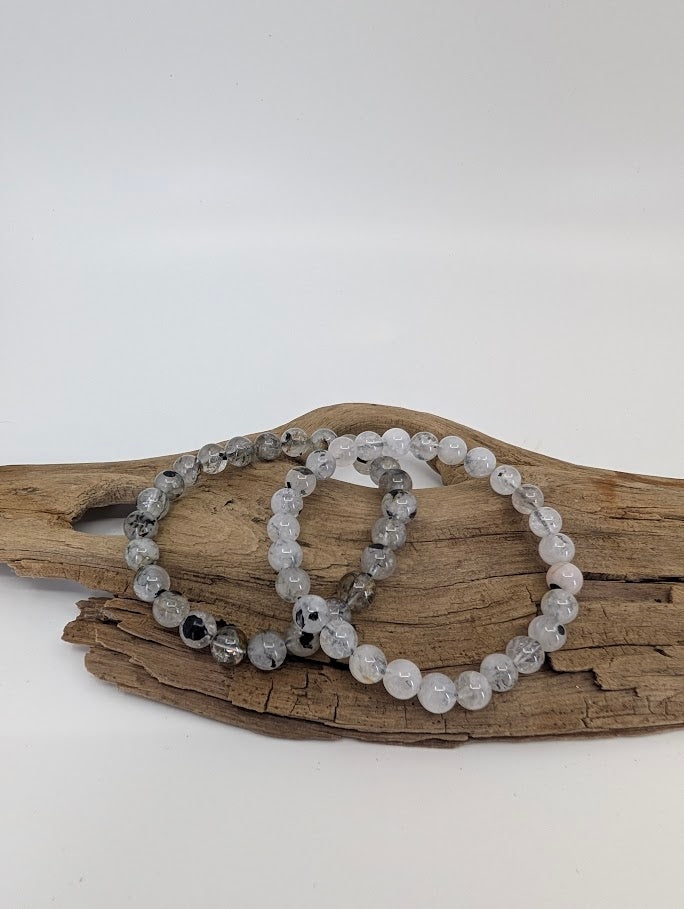 Herkimer style quartz bracelets in natural light showing clear double terminated beads