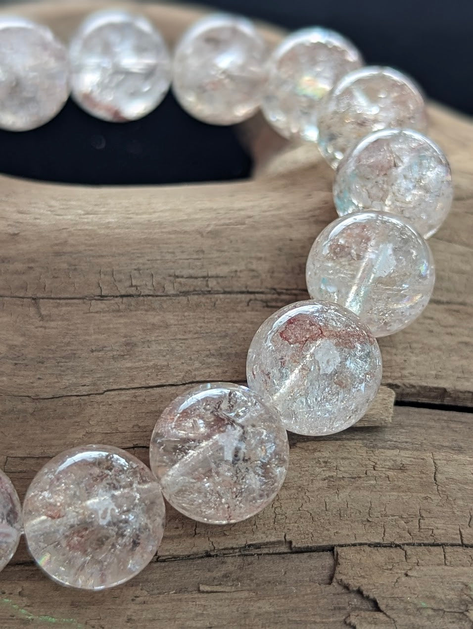 Macro detail of 13mm Himalayan Garden Quartz beads capturing the flawless quartz matrix and vivid internal garden inclusions.